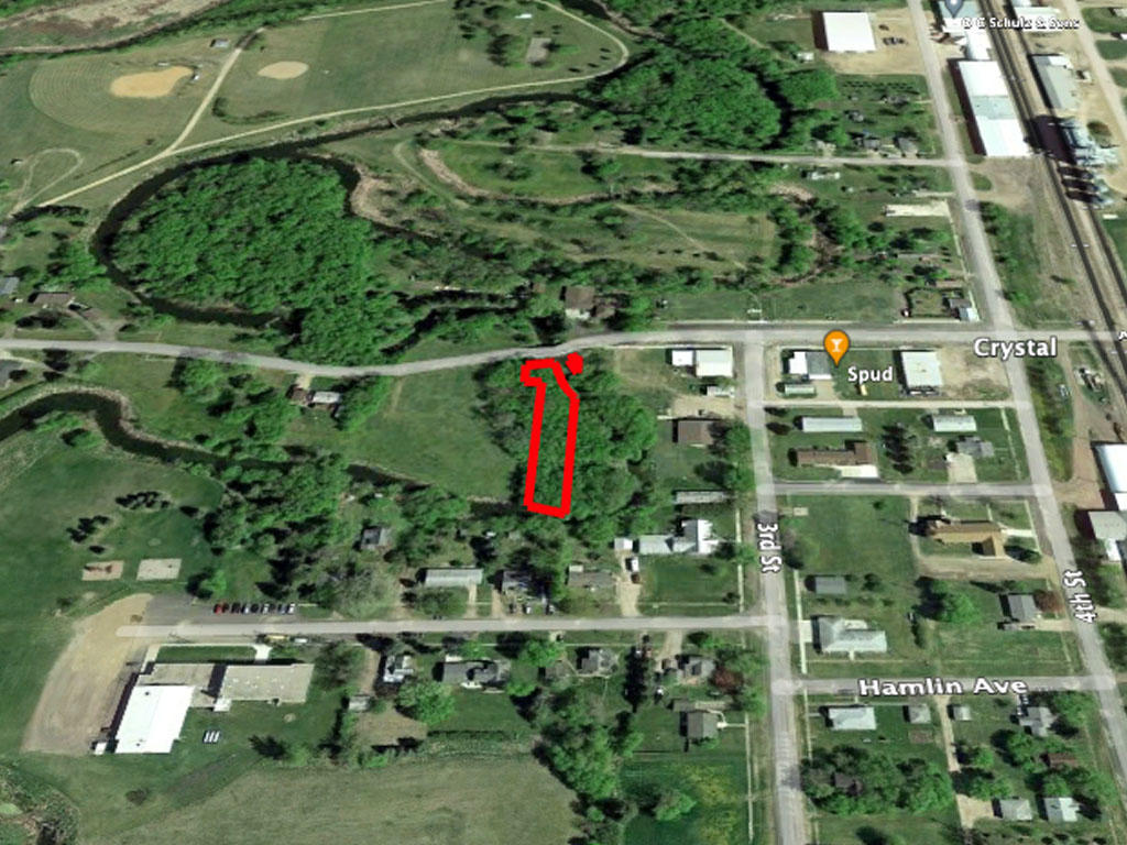 Nice sized lot alongside a creek in a beautiful, small town - Image 2