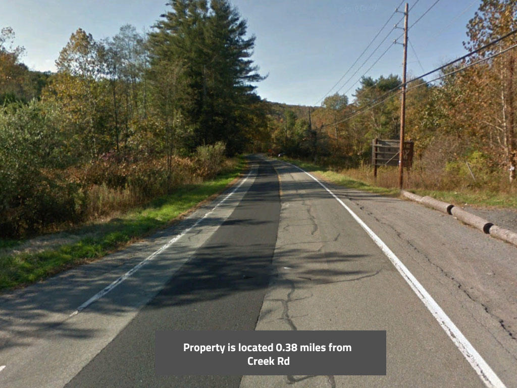 Large, beautifully wooded property at the T in the road. - Image 4