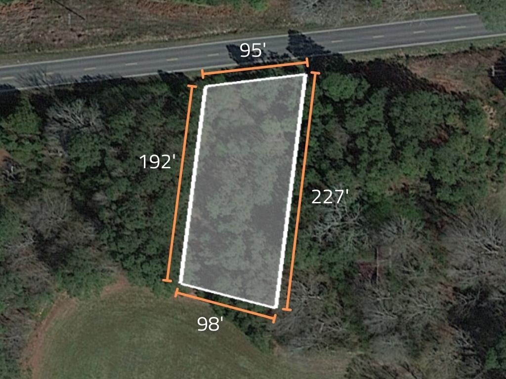 Almost half an acre of beautiful wooded property next to a church - Image 1