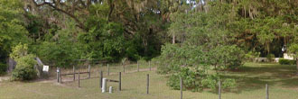 Beautifully wooded lot at a T in the road in small town Florida